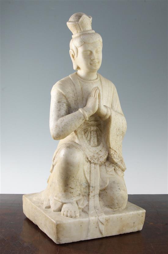 A Chinese white marble kneeling figure of a monk, Qing dynasty, 48.5cm